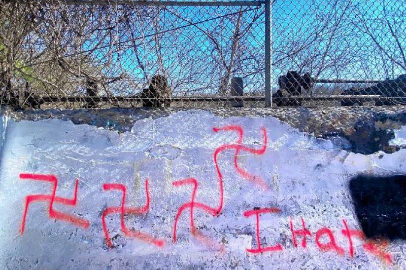 Racist graffiti was spray painted on the wall of the old railroad trestle near the walkway near the Merrimack River just north of the parking lot for the Sewalls Falls. GEOFF FORESTER
