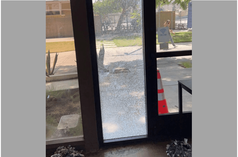 The shattered window at USC Hillel was discovered Tuesday morning and an investigation was launched within a half hour. (Photo courtesy of @StopAntisemites (Twitter))